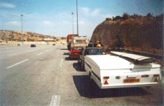 Folding portable Portaboat boat atop atop a folding camper