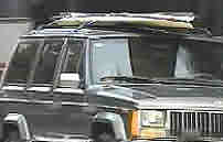 Folding portable Portaboat boat atop Jeep SUV